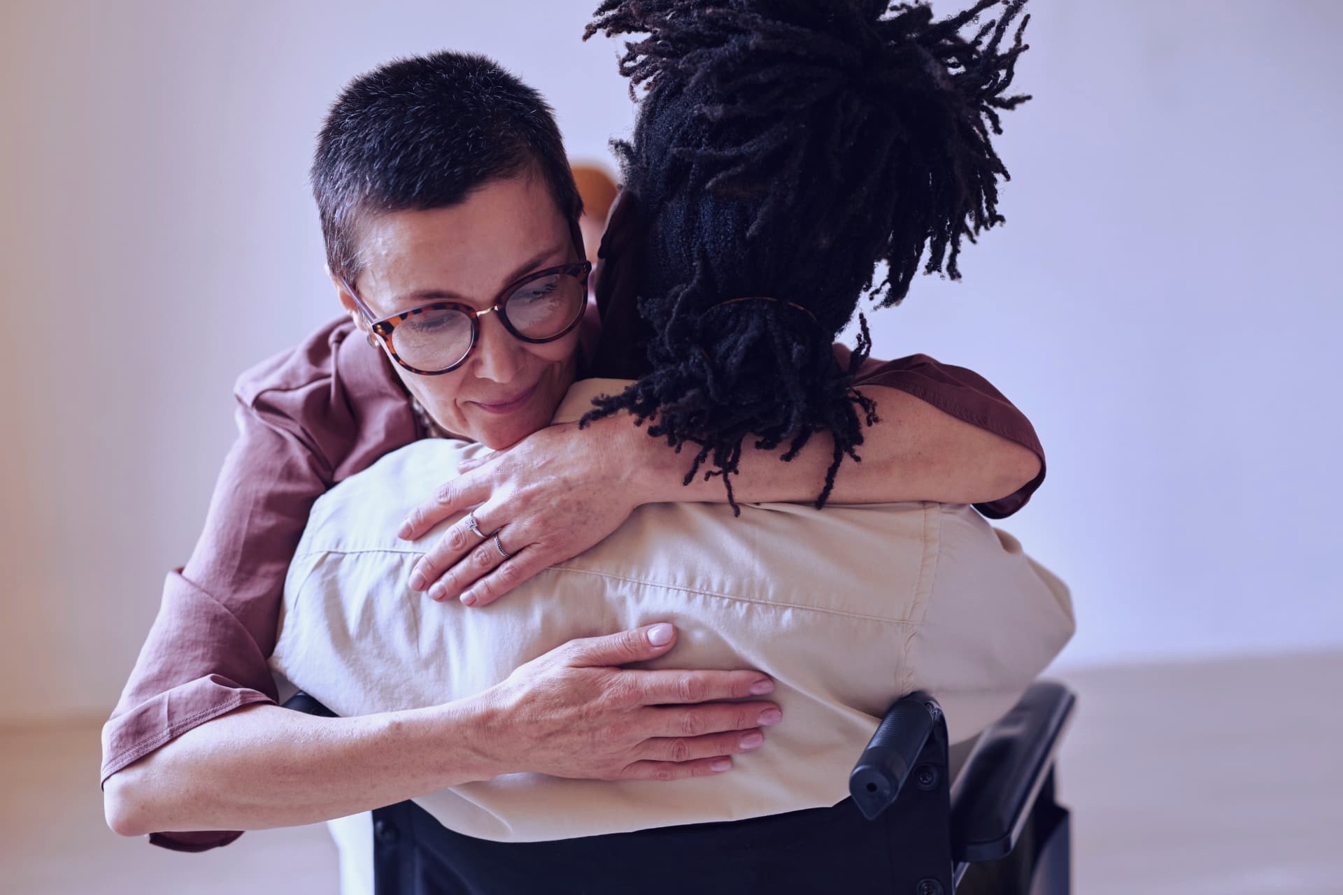 Two women sharing a heartfelt embrace